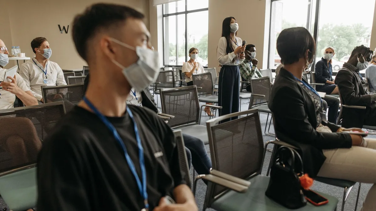 A group of diverse adults attending a business seminar w