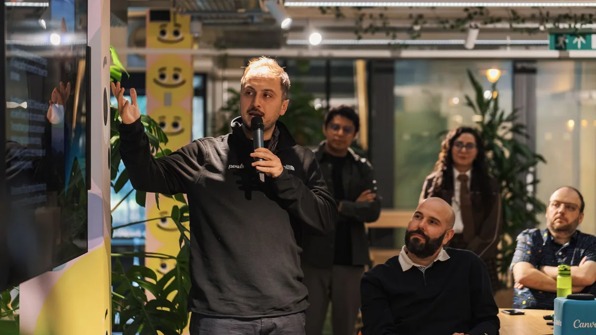 A presenter delivers a business presentation in a modern