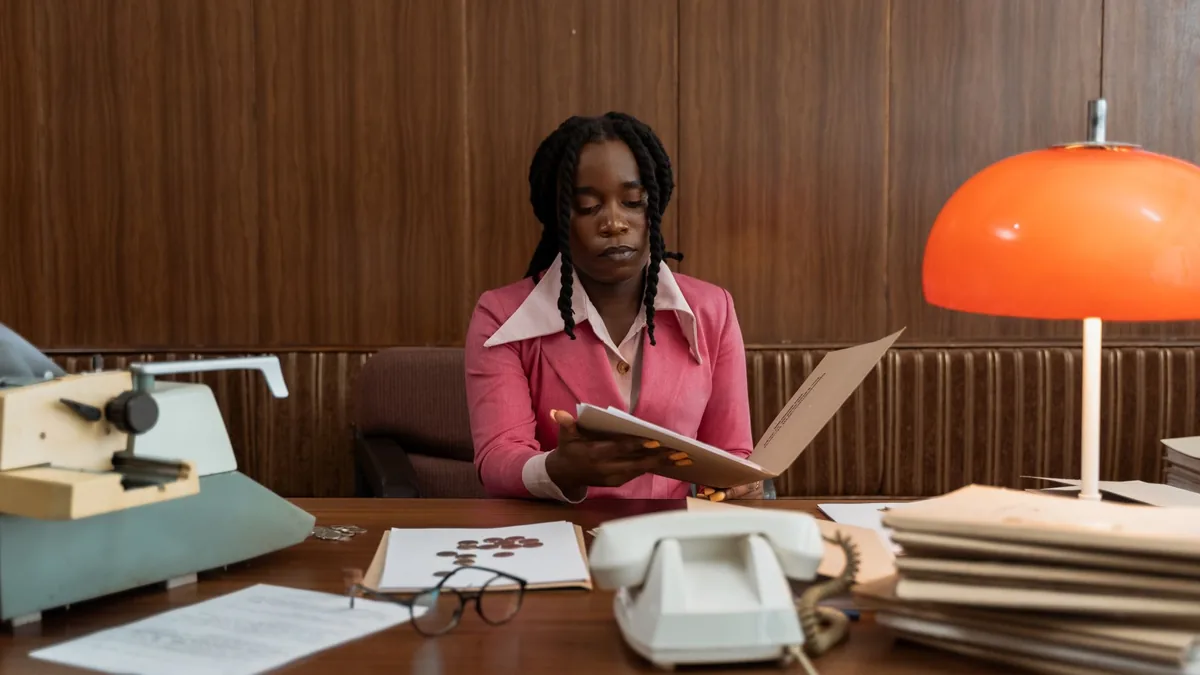 A professional african american woman working with files