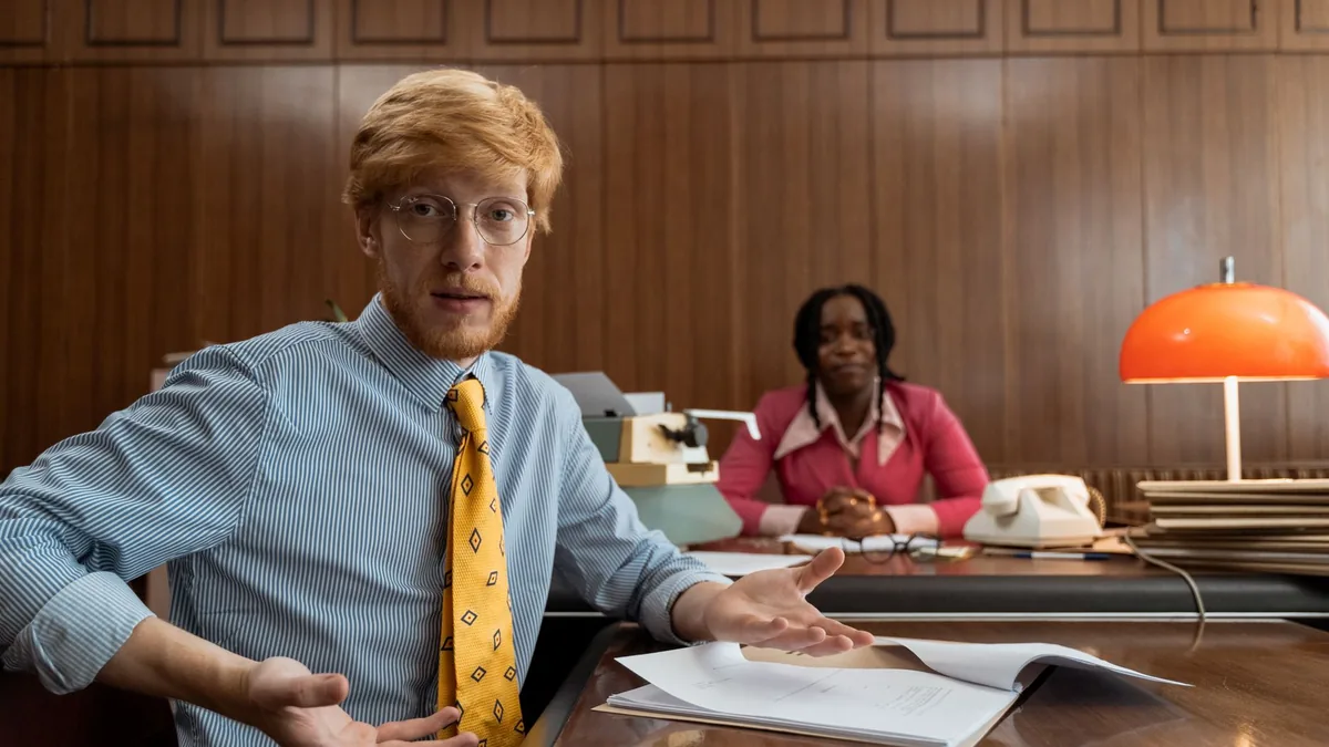 A retro office setting with two professionals focusing o