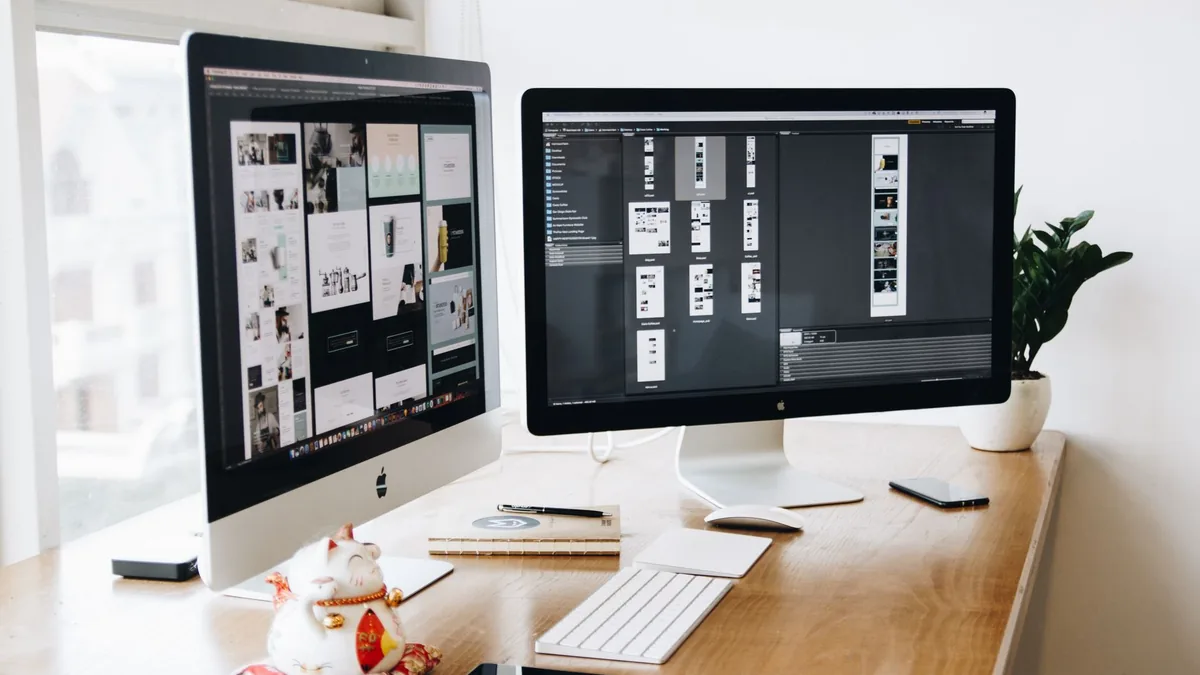 A well organized design workspace with dual monitors and