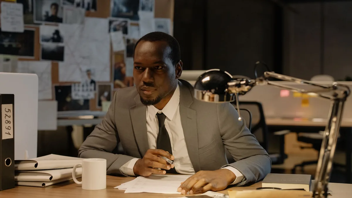 African american businessman in a suit working at a desk