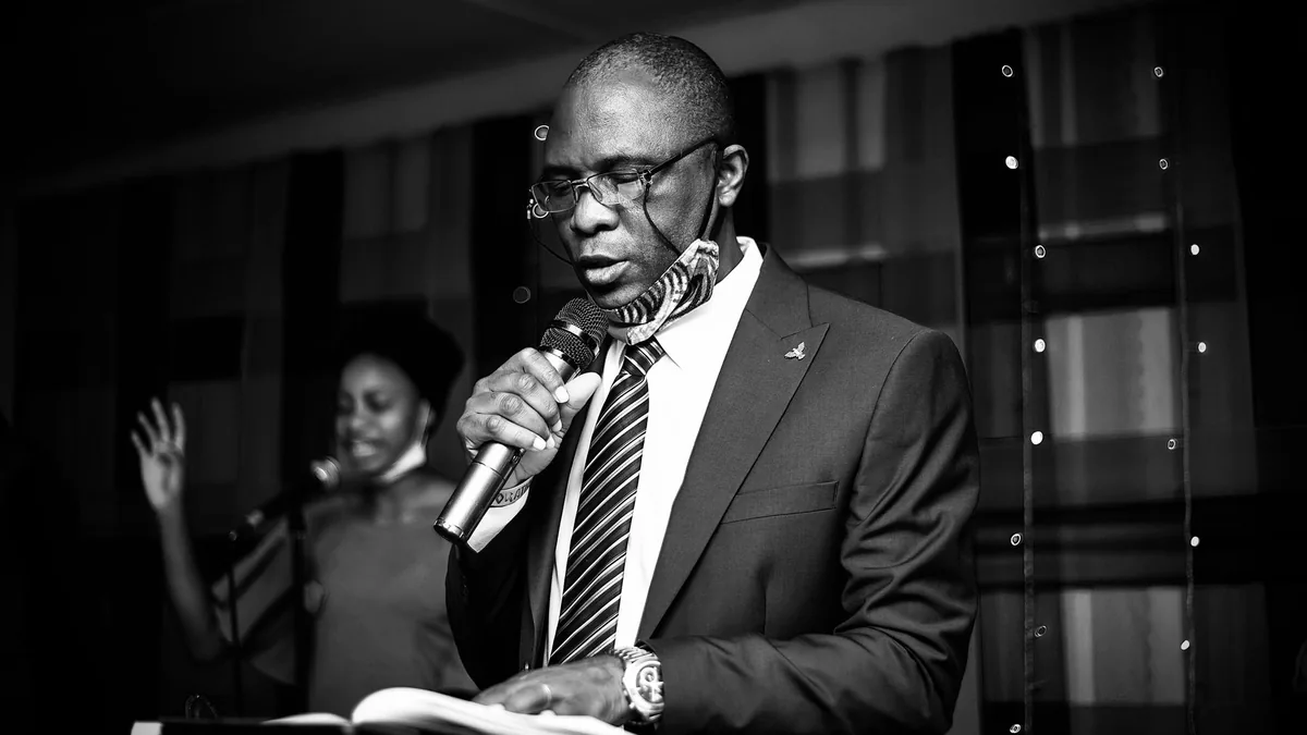 Black and white photo of a businessman in formal wear sp