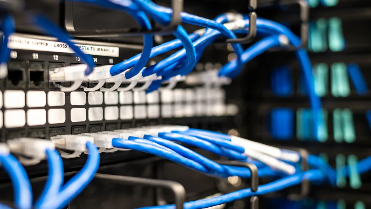 Blue plastic wires with white tips connected to server a
