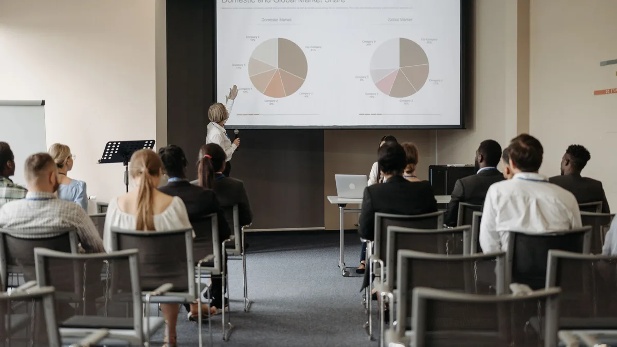 Business conference with diverse audience and speaker pr