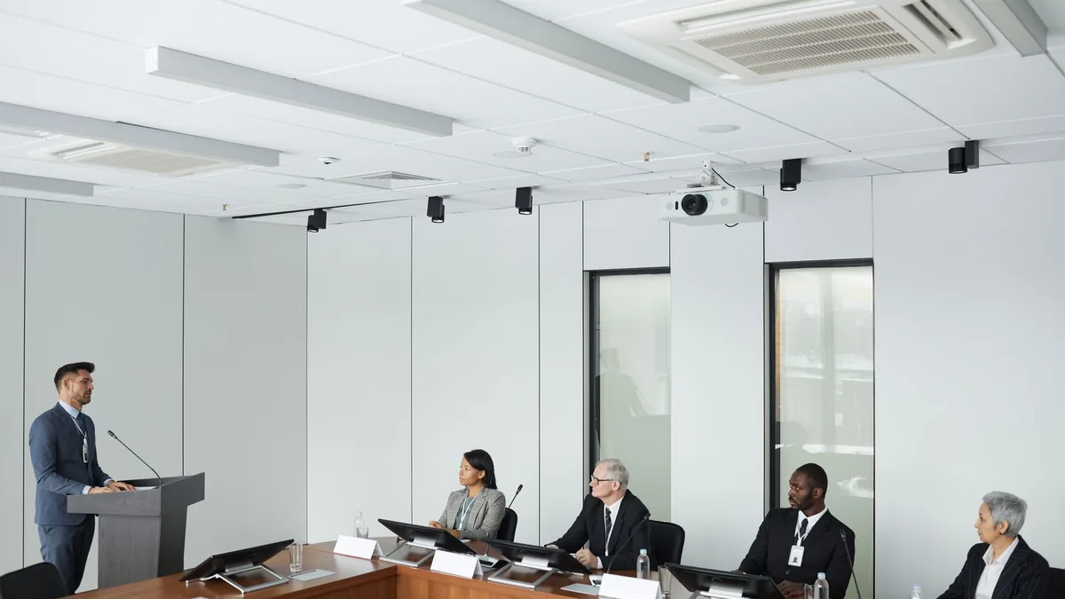 Business presentation with diverse colleagues in a moder