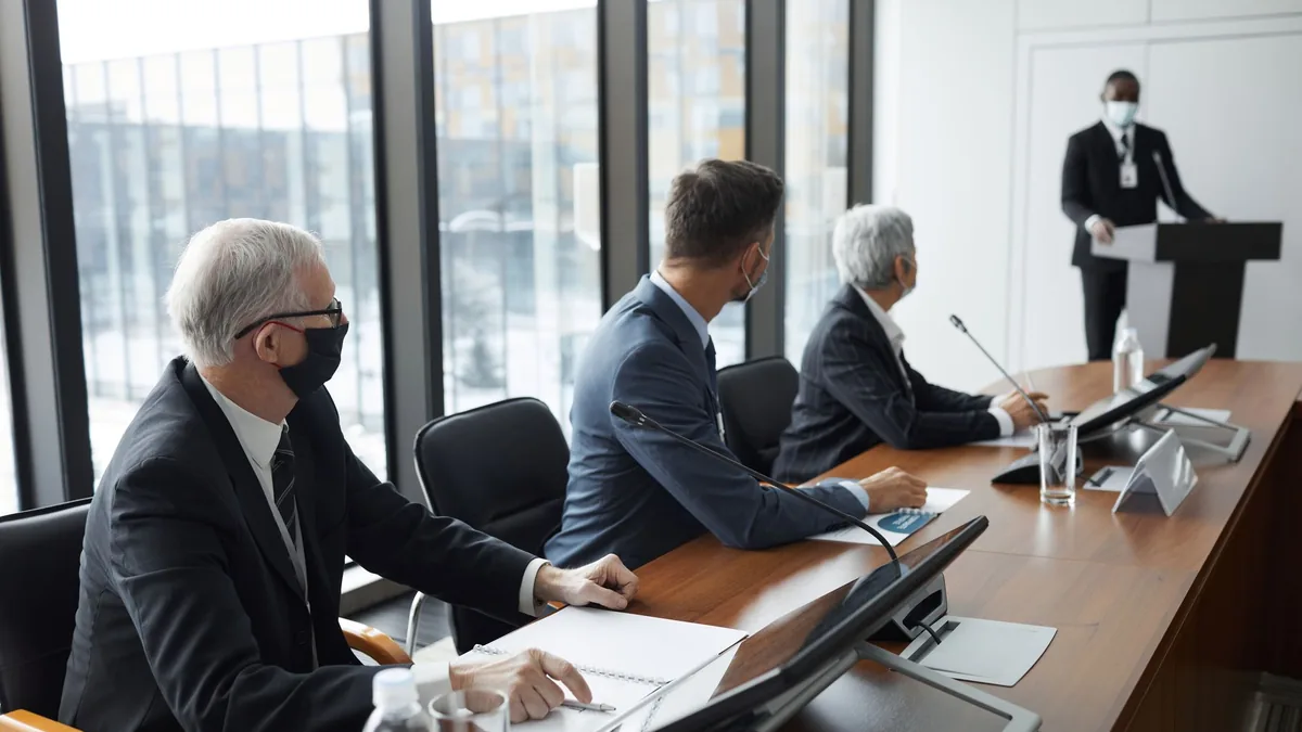 Business professionals discussing in a conference room w