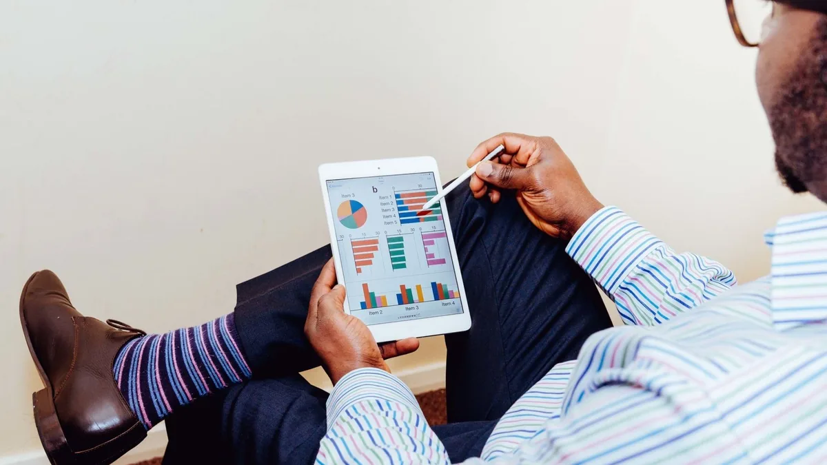 Businessman using a tablet for data analysis in a relaxe