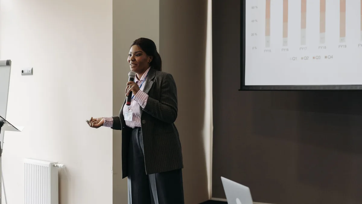 Businesswoman delivering an engaging presentation at a c