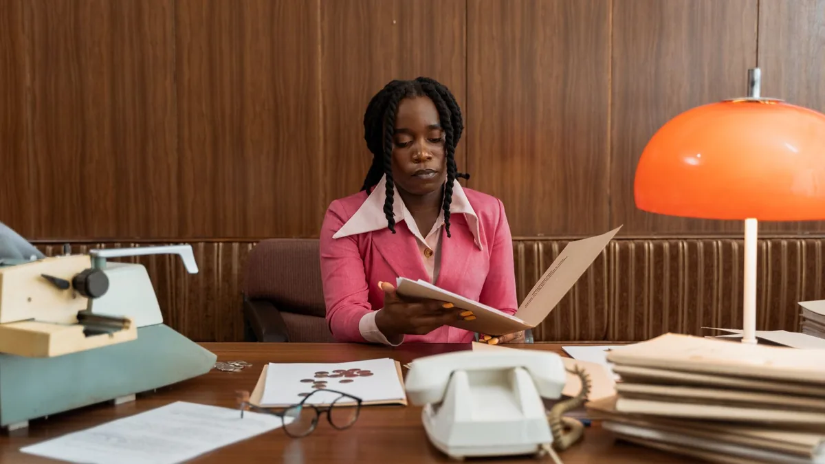Businesswoman in vintage office setting with documents a