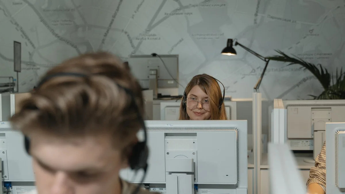 Call center employees working with computers and headset