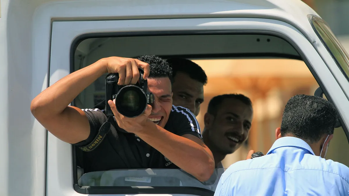 Candid scene of a photographer capturing a moment from a