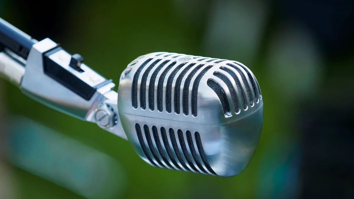 Classic chrome vintage microphone with defocused green o
