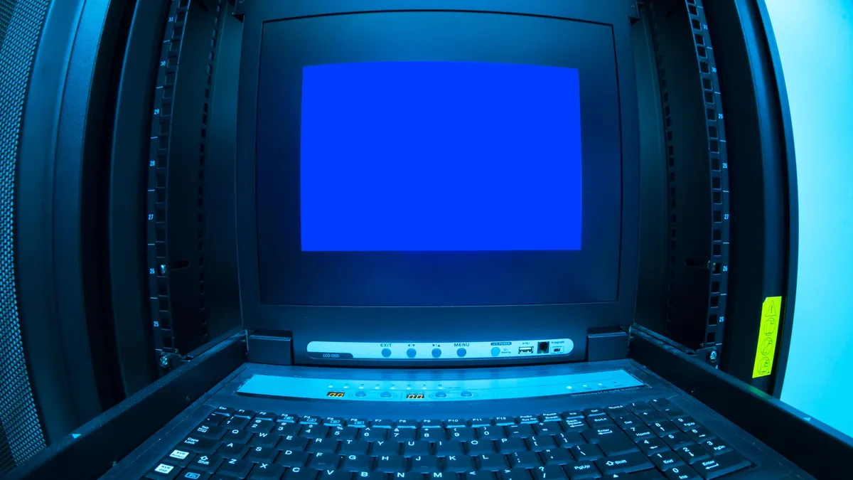 Close up of a blue screen error shown on a data center c