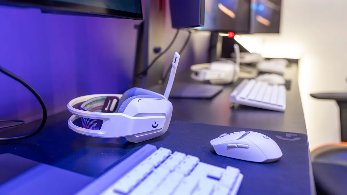 Close up of a gaming setup featuring a white headset com