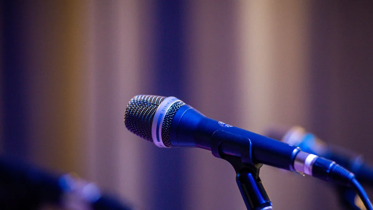 Close up of a professional microphone on stage with blur