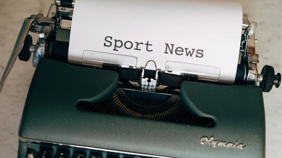 Close up of a vintage typewriter with a paper showing sp