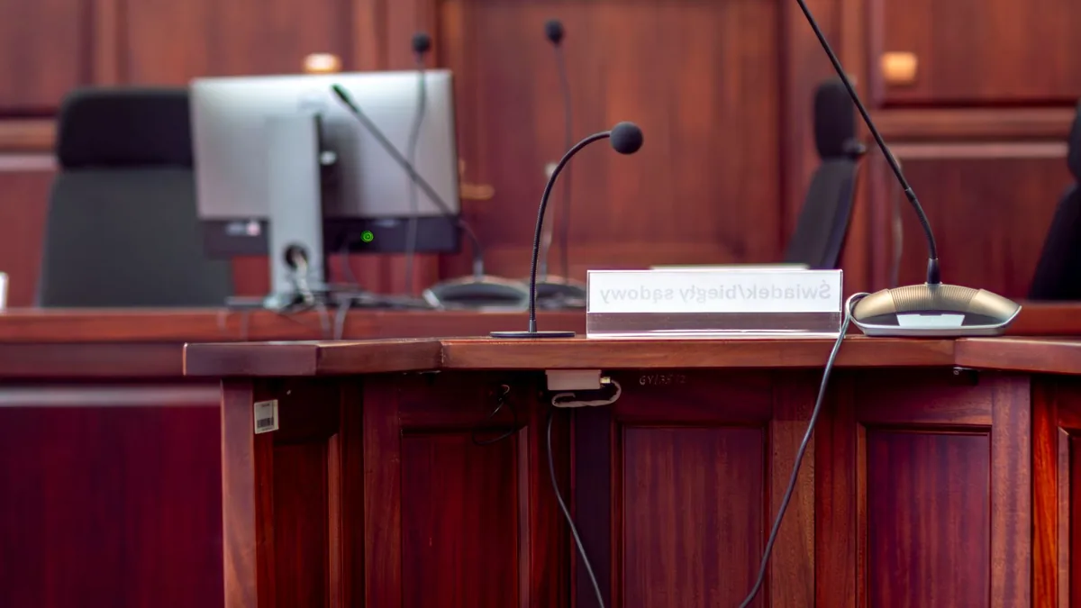 Close up of a wooden podium with microphones in a polish