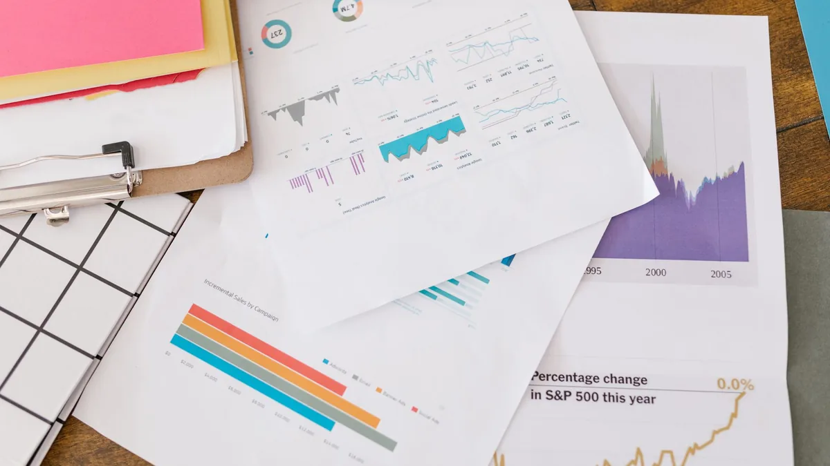 Close up of business analytics charts and graphs on pape