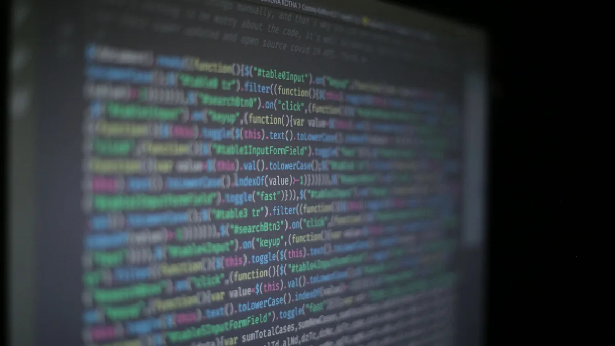 Close up of colorful programming code on a blurred compu