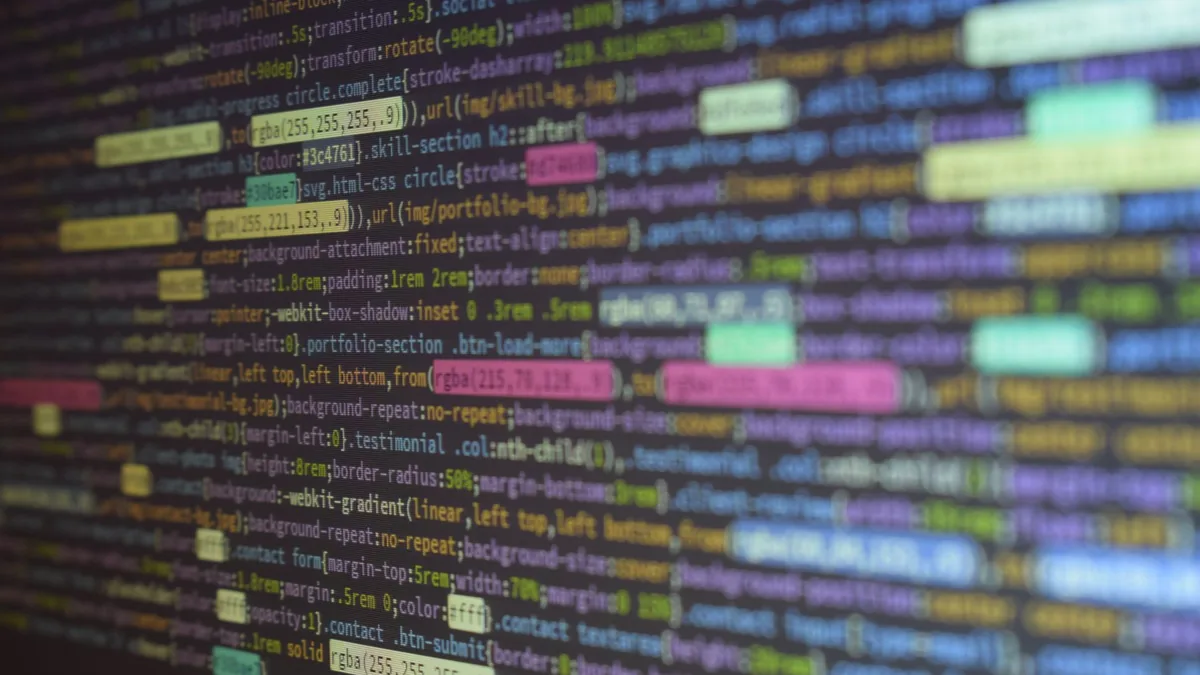 Close up of colorful source code on a monitor showcasing