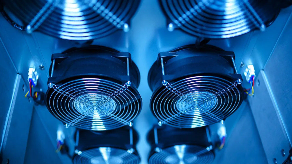 Close up of cooling fans in a server room showcasing tec
