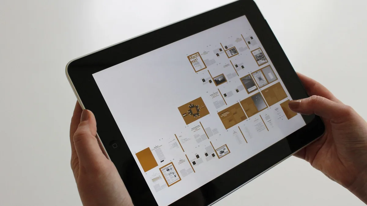 Close up of hands using a tablet displaying a digital in