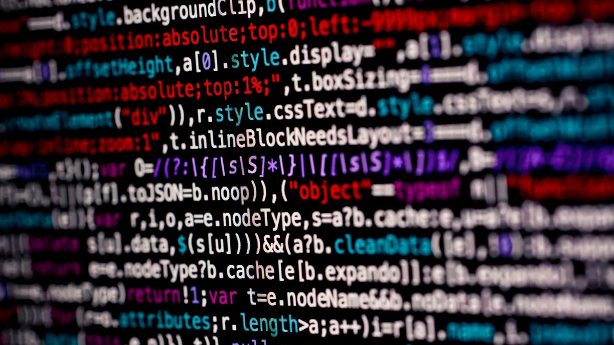 Close up of multicolored code on a computer screen highl