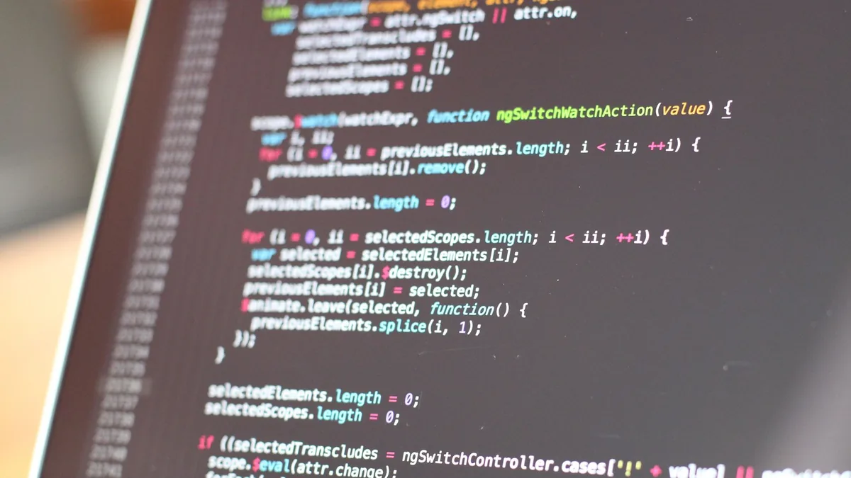 Close up view of colorful code on a laptop screen showca