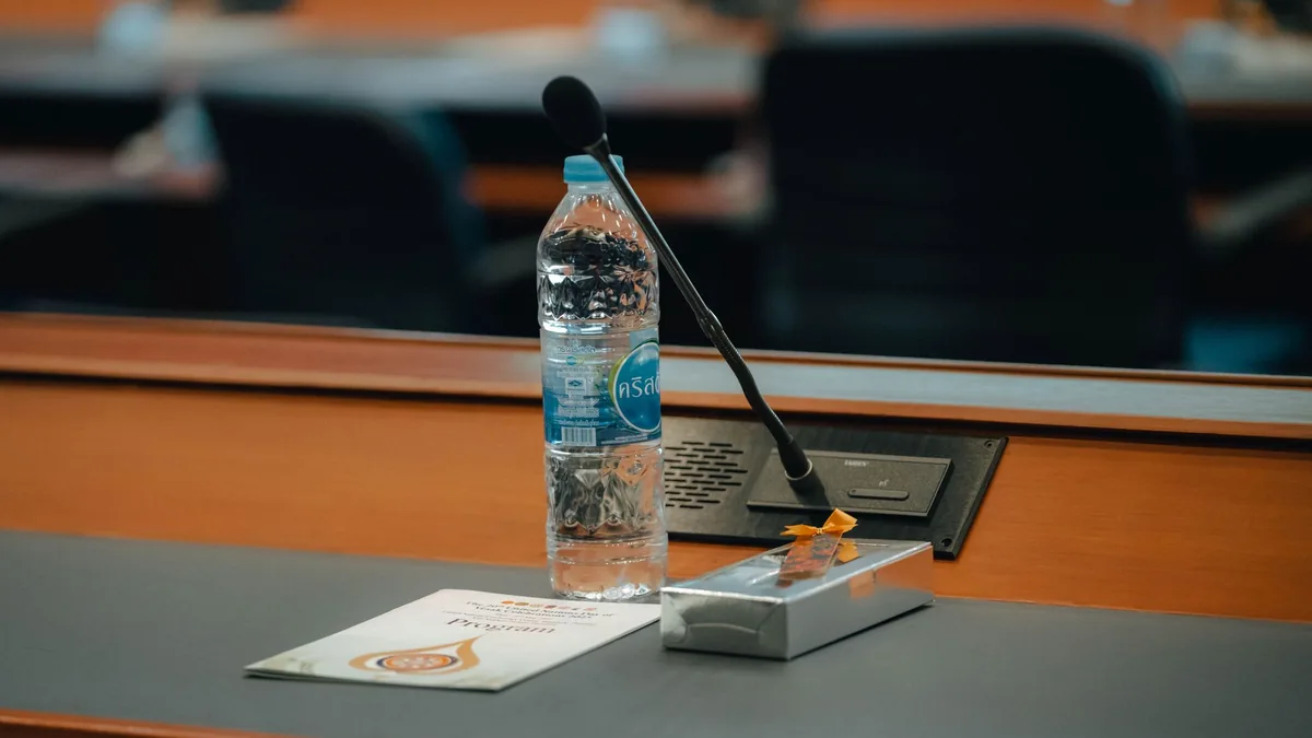Conference table setup in thailand with bottled water mi