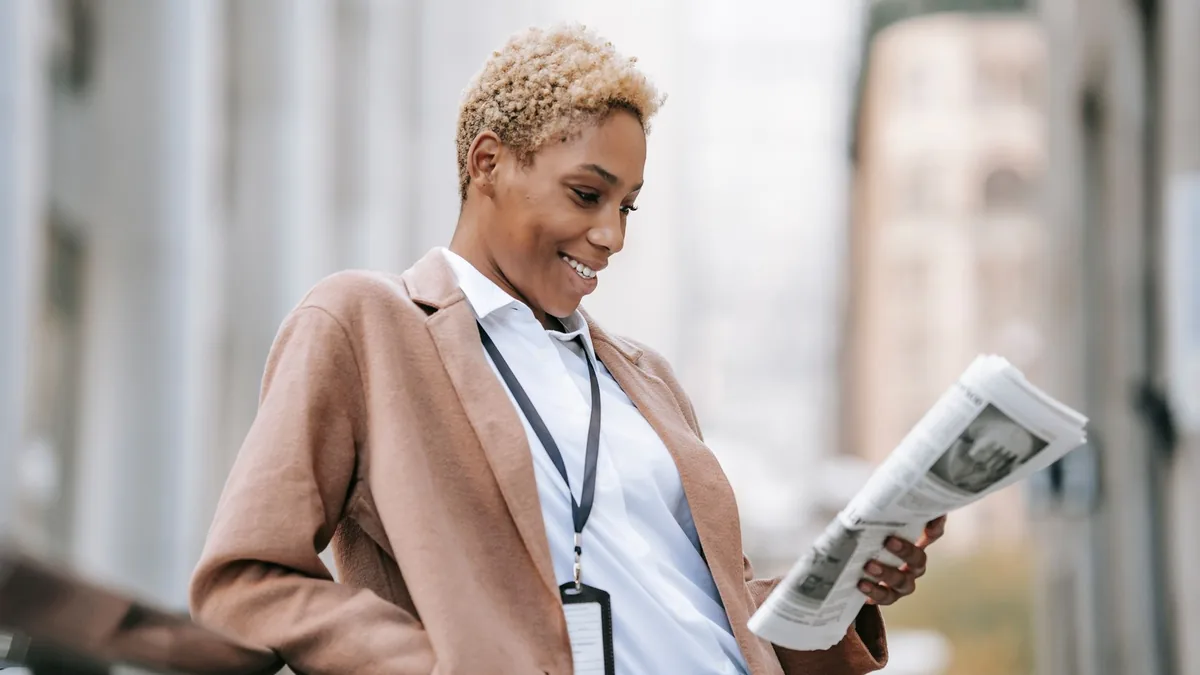 Delighted young african american female entrepreneur in