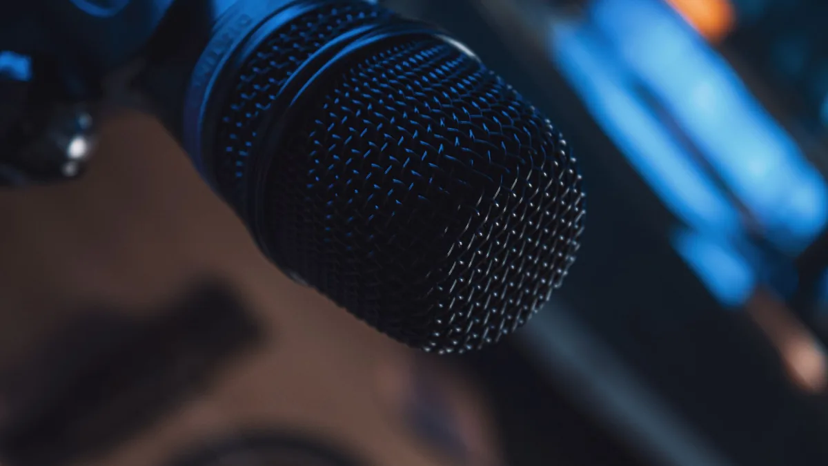 Detailed shot of a metallic microphone in a studio setti