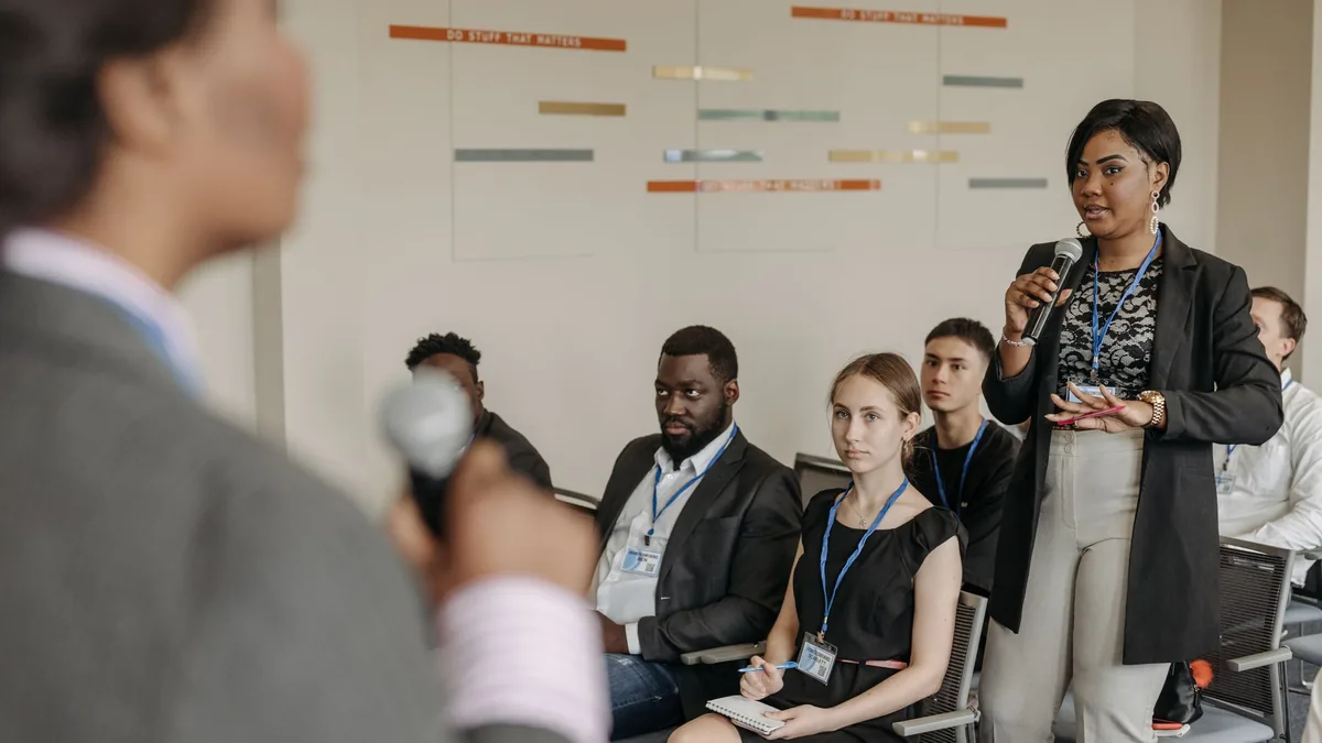 Engaged business discussion at a conference with diverse
