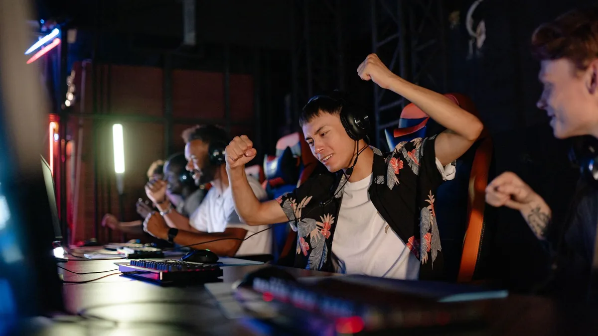 Excited gamers celebrating a win in a competitive gaming