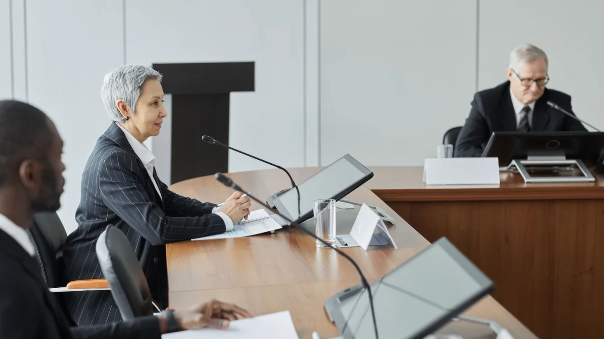 Executives in a conference room engaging in a profession