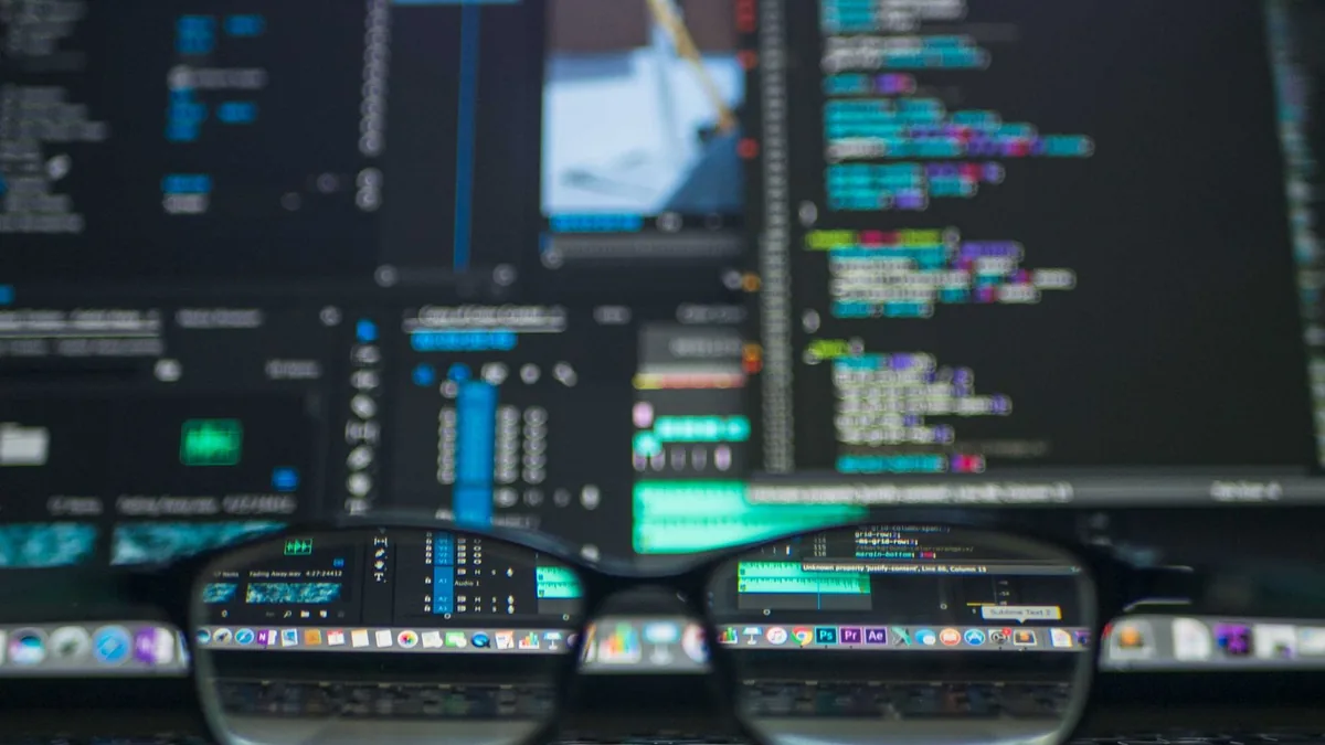 Eyeglasses reflecting computer code on a monitor ideal f