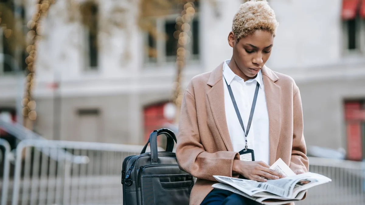 Focused young african american businesswoman with badge