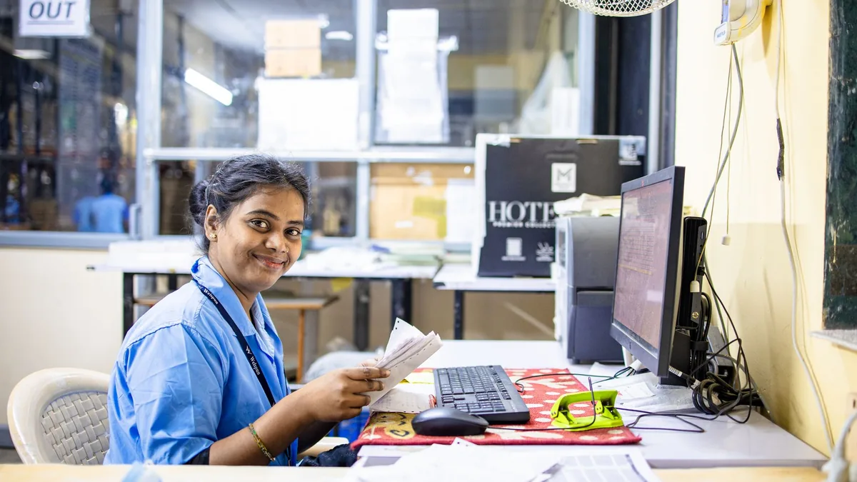 Friendly office worker in a modern workspace smiling whi