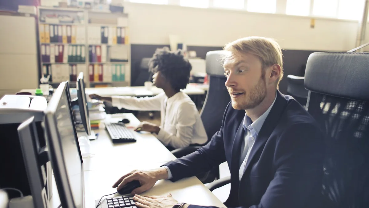 High angle of pensive shocked businessman in elegant clo