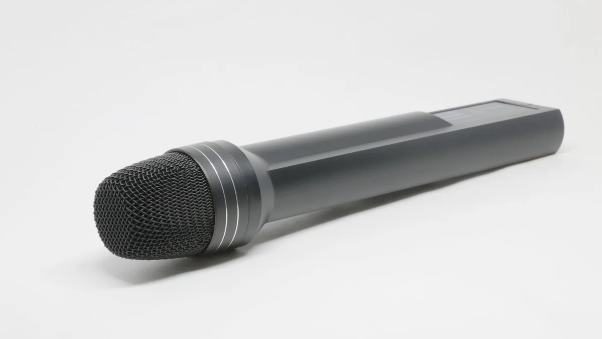 High quality close up of a black handheld microphone on
