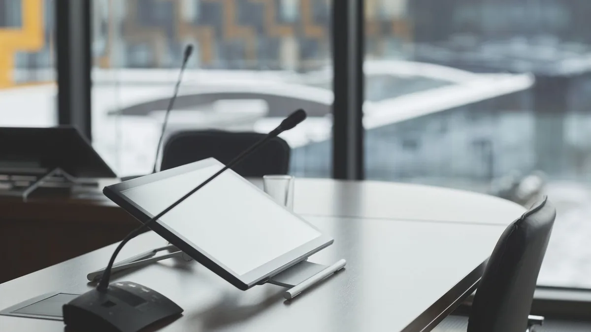 High tech conference room with digital tablets and micro
