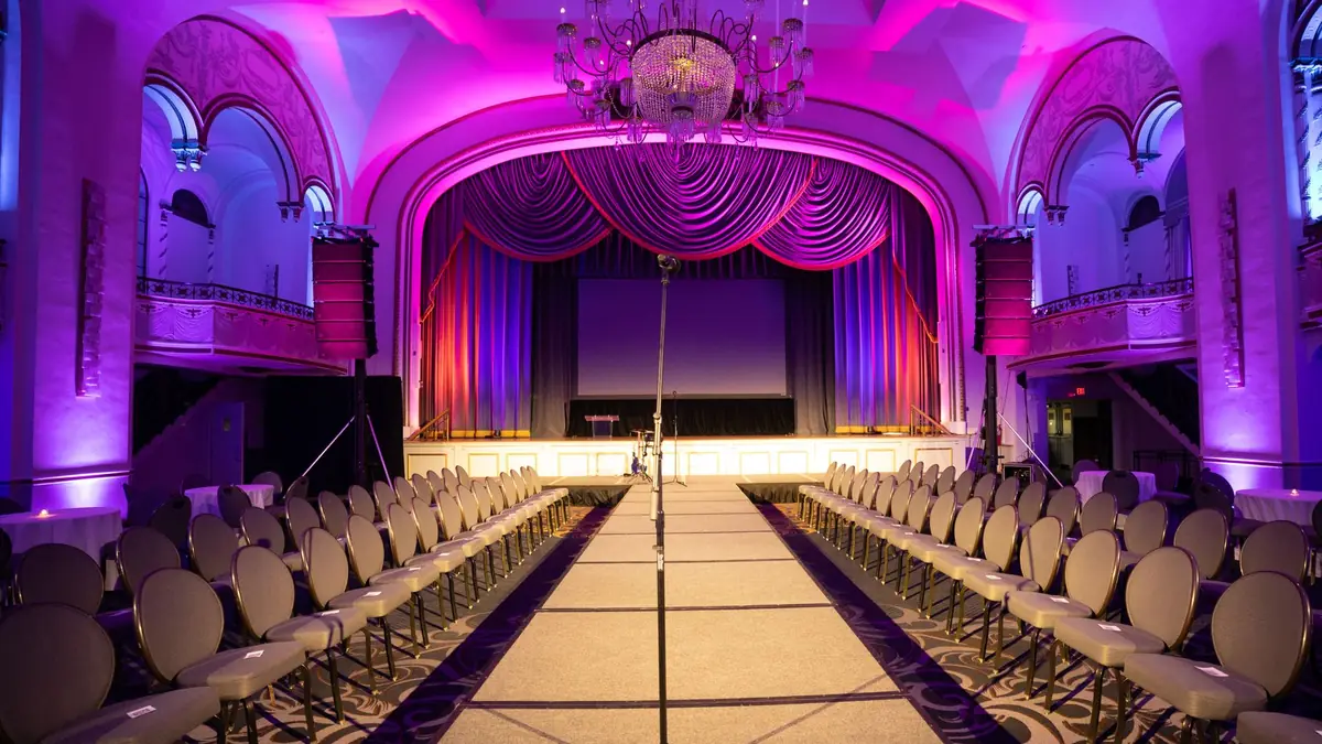 Lavish auditorium setup with a central runway and grand