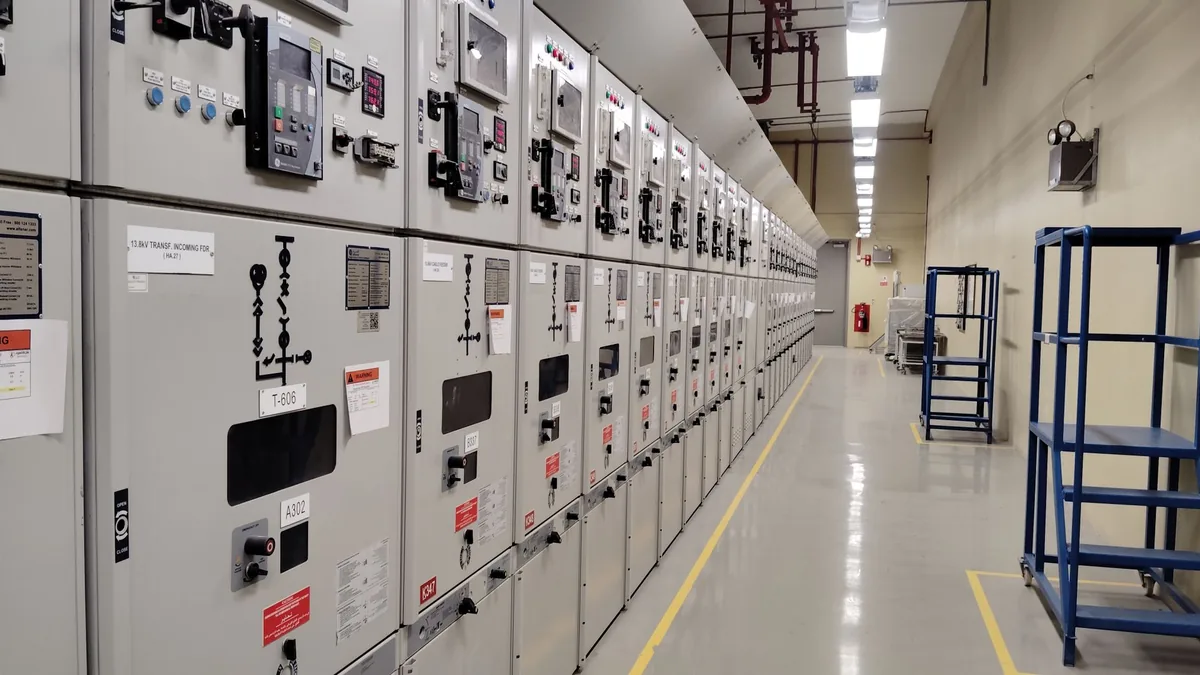 Long row of control panels in an industrial electrical c