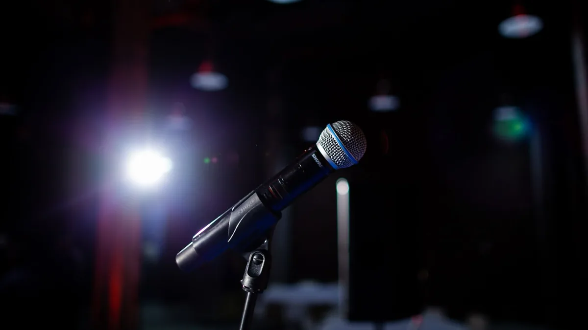 Microphone on a stage with spotlight perfect for perform