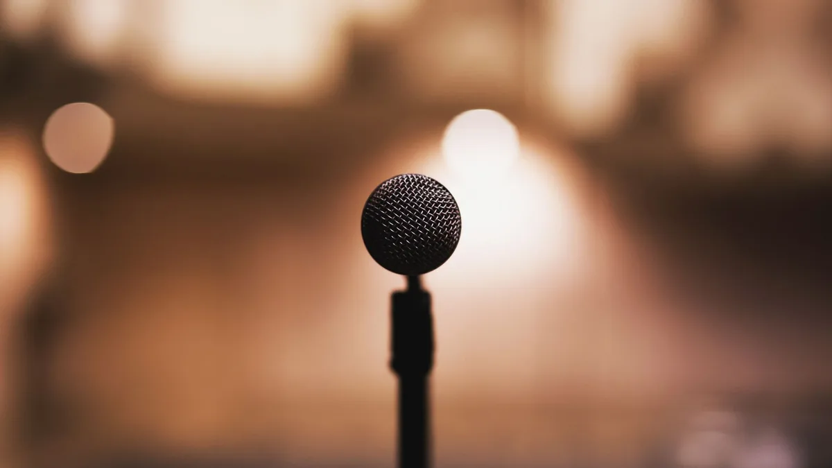 Microphone on stand with blurred background ideal for mu