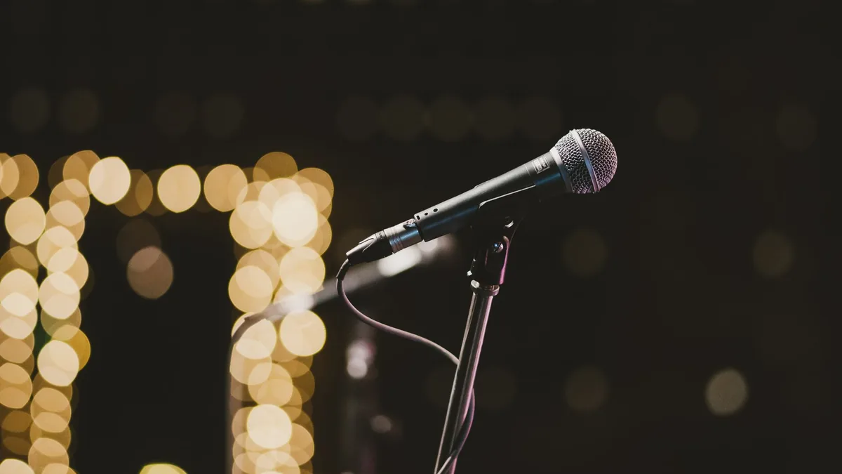Microphone on stand with bokeh lights in the background