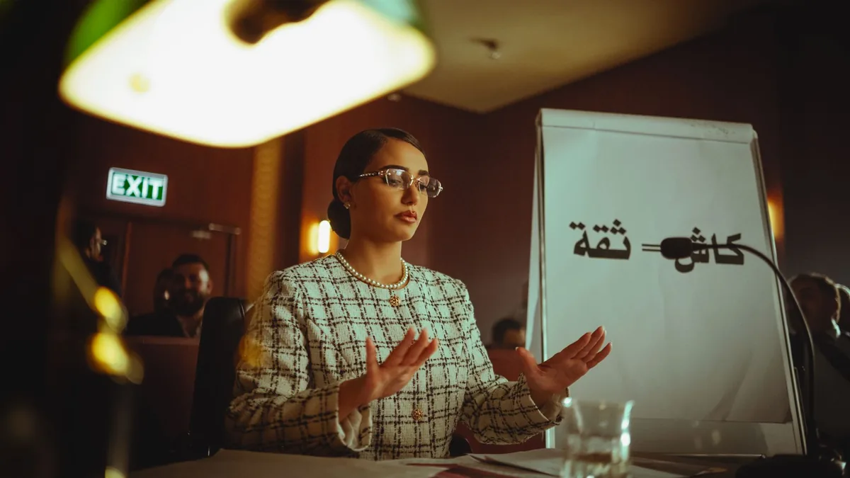 Middle eastern woman speaking at a conference in baghdad