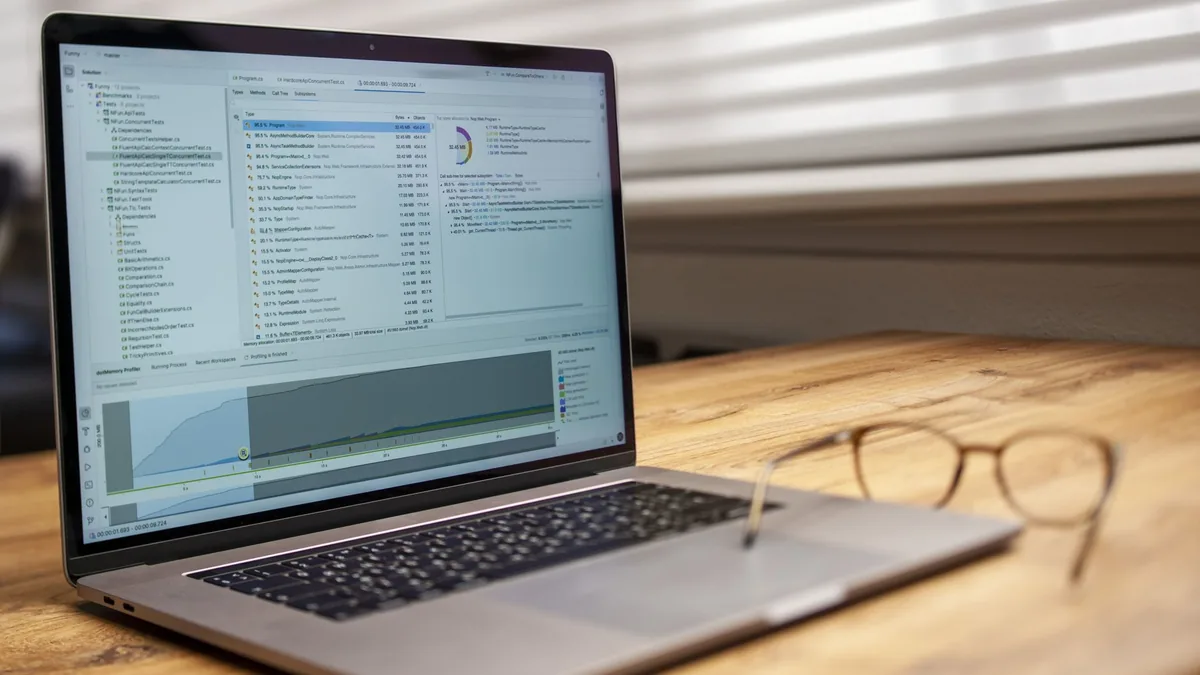 Modern laptop on a wooden desk displaying analytical sof