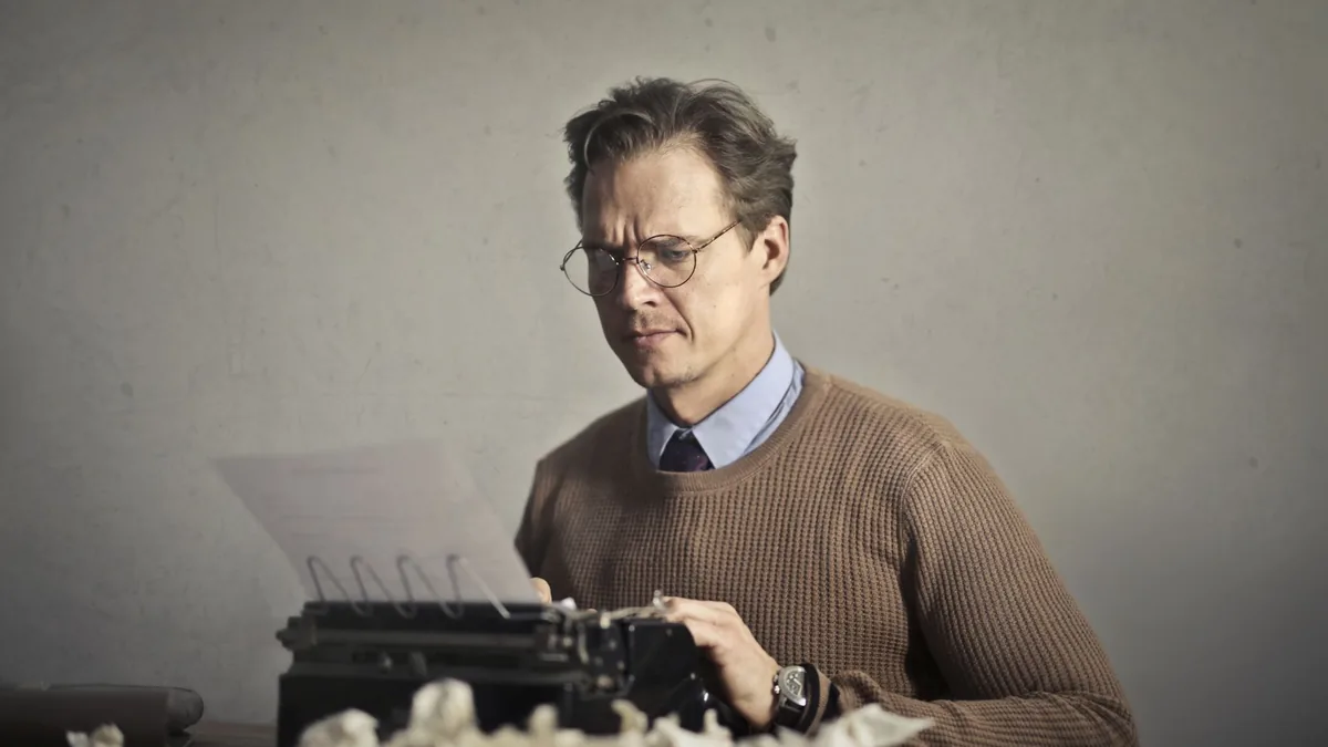 Pensive displeased man in glasses and elegant clothes si
