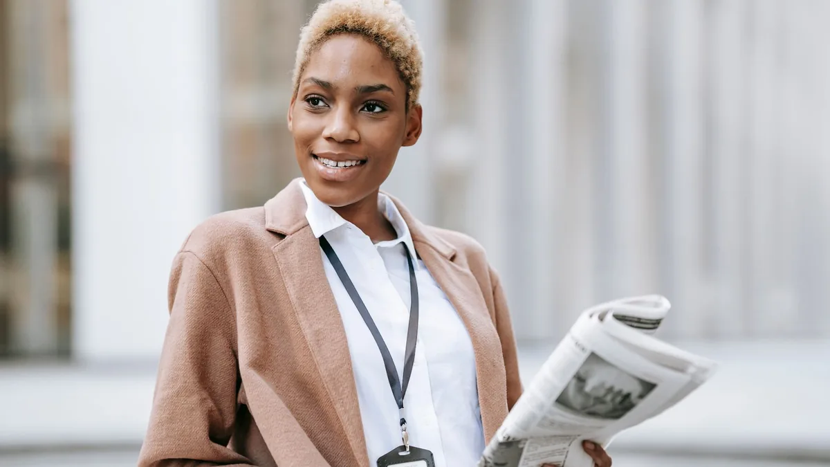 Positive young african american female entrepreneur with